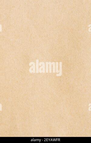 Feuille de carton jaune abstrait utile comme fond. Vue détaillée de la texture du carton recyclé. Banque D'Images