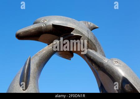 En oman, ancienne statue de dauphin Banque D'Images