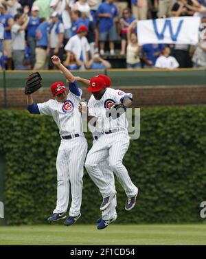 Chicago Cubs' Alfonso Soriano, right, celebrates with Kosuke Fukudome of  Japan, after the Cubs beat the