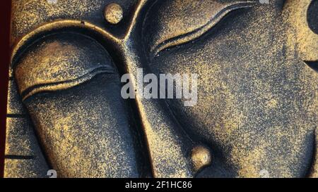Bouddha doré visage gros plan Banque D'Images