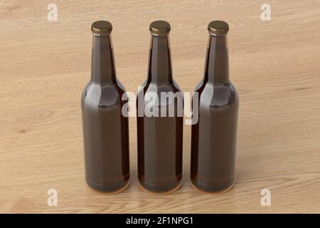 Trois bouteilles de bière 500ml maquette sur fond en bois. Vue latérale Banque D'Images