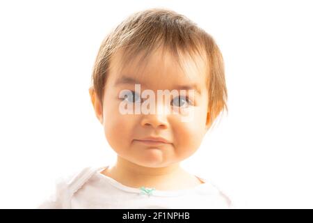 Gros plan d'un bébé fille de 1 an avec un Expression du visage surprise Banque D'Images