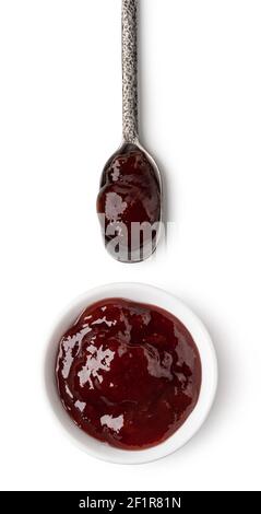 Petit bol en verre et cuillère de confiture de baies rouges Banque D'Images