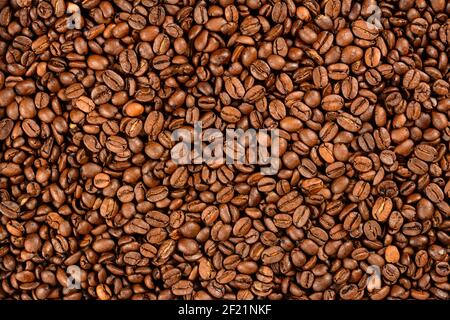 Fond de grains de café. Grains de café torréfiés Banque D'Images