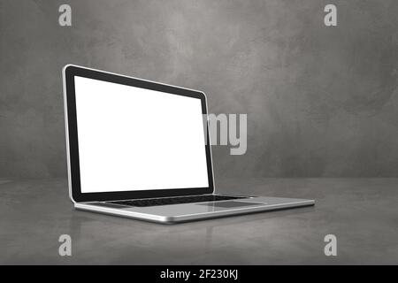 Ordinateur portable sur fond de scène de bureau en béton Banque D'Images