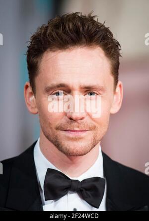 Tom Hiddleston assiste aux EE British Academy film Awards 2015, à l'Opéra Royal de Covent Garden à Londres Banque D'Images