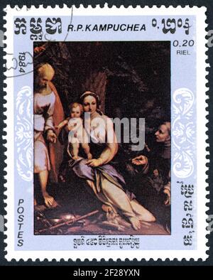KAMPUCHEA - VERS 1984: Un timbre imprimé à Kampuchea, montré les détails de peintures: Repos sur vol en Egypte, par Antonio da Correggio, vers 1984 Banque D'Images
