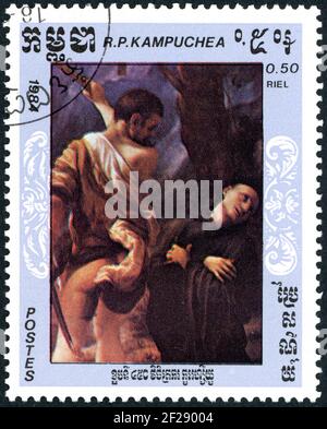 Un timbre imprimé à Kampuchea, montre les détails de peintures: Martyre des quatre Saints, par Antonio da Correggio, vers 1984 Banque D'Images