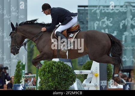 Jerome Hurel (FRA) à cheval sur Quartz Rouge lors du Prix Jaulin, la Tour des champions mondiaux des Longines de Paris le saut de Paris présenté par Gucci 2014 - champs de Mars , Paris Tour Eiffel, à Paris, France, le 5 juillet 2014 - photo Christophe Bricot / DPPI Banque D'Images