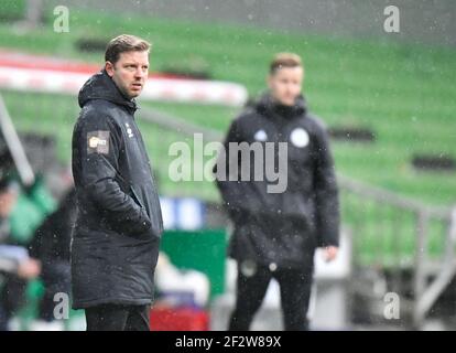 Brême, Allemagne. 13 mars 2021. Football: Bundesliga, Werder Bremen - Bayern Munich, Matchday 25 à wohninvest Weserstadion. L'entraîneur de Brême, Florian Kohfeldt, suit le match. Crédit : Martin Meissner/AP-Pool/dpa/Alay Live News Banque D'Images