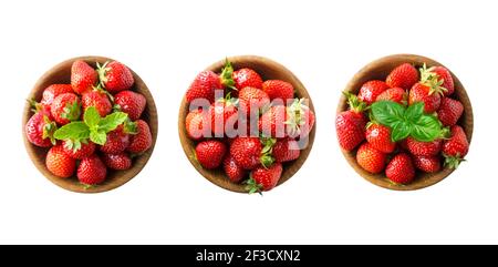 Vue de dessus. Fraise isolée. Fraises sur un bol en bois. Ensemble de fraises isolées sur découpe blanche. Collection de fraises entières sur le blanc b Banque D'Images