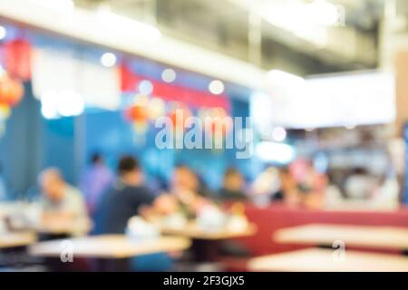 Image floue de l'intérieur du restaurant avec les gens Banque D'Images