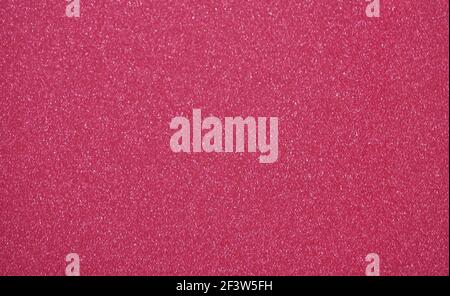 Arrière-plan monochrome de couleur bordeaux profonde avec petits gros plan étincelants de silvery. Arrière-plan, motif, texture. Banque D'Images