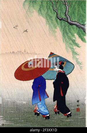 L'œuvre d'Ohara Koson intitulée deux beautés dans la pluie. Deux femmes japonaises habillées traditionnellement marchent ensemble sous la pluie. Parasols en place. Banque D'Images