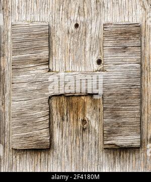 La lettre H est sciée en bois abîmé Banque D'Images