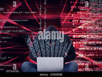 Composition du traitement des données et du codage binaire sur hacker in capuche à l'aide d'un ordinateur portable Banque D'Images