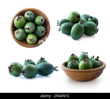 Fruits de feijoa verts dans un bol en bois isolé sur fond blanc. Vue de dessus. Fruits de différents angles sur blanc. Ensemble de fruits féijoa. Banque D'Images