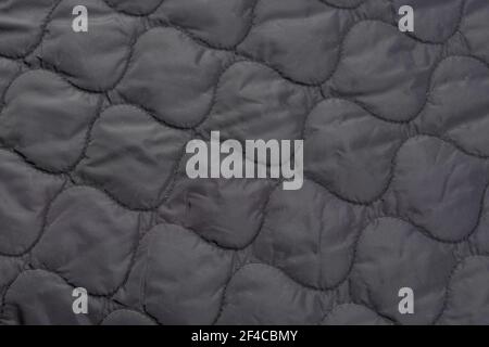 Gros plan sur un morceau de tissu matelassé, doublure de la veste Banque D'Images