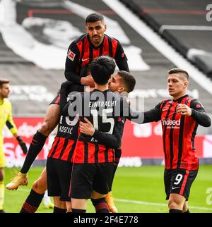 Francfort, Allemagne. 20 mars 2021. Andre Silva (2e R) de Francfort célèbre sa première évaluation avec ses coéquipiers lors d'un match de football allemand Bundesliga entre Eintracht Frankfurt et FC Union Berlin à Francfort, Allemagne, le 20 mars 2021. Credit: Joachim Bywaletz/Xinhua/Alay Live News Banque D'Images