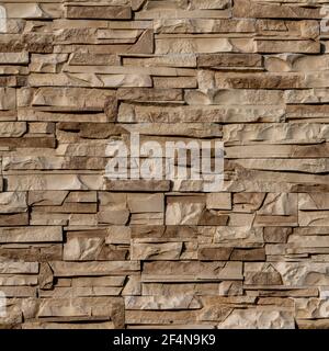 Texture sans couture du clinker sur le mur sous forme de pierre sauvage. Tons beige et marron avec ombres et texture profonde. Banque D'Images