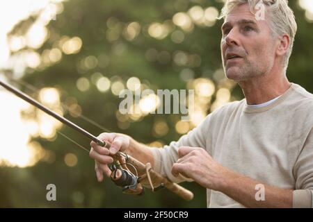 Gros plan homme pêche à la mouche Banque D'Images