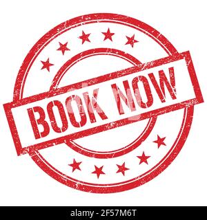 LIVRE MAINTENANT texte écrit sur rouge rond vintage caoutchouc timbre. Banque D'Images