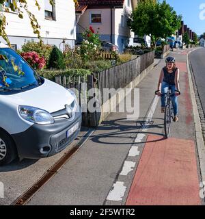 Situation dangereuse pour les cyclistes à la sortie de la propriété Banque D'Images