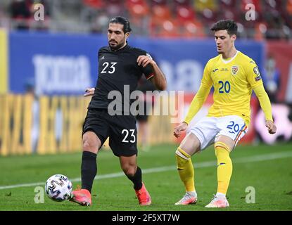 Duels, duel Emre CAN (Allemagne)/l. versus Dennis Man (ROU)/r. Qualification GES/football/coupe du monde: Roumanie - Allemagne, 28 mars 2021 football/football: Coupe du monde match de qualification: Roumanie contre Allemagne, Bucarest, Roumanie, 28 mars 2021 | utilisation dans le monde entier Banque D'Images