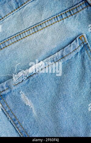 Arrière-plan denim texture Jean. La texture du tissu de coton. Gros plan. Recadrage vertical. Banque D'Images