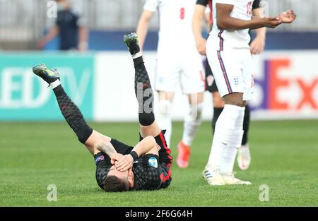 Dario Vizinger, en Croatie, semble blessé lors du match de championnat européen des moins de 21 ans de l'UEFA en 21 au stade Bonifacika de Koper, en Slovénie. Date de la photo: Mercredi 31 mars 2021. Banque D'Images