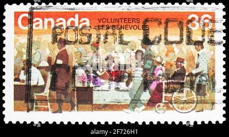 MOSCOU, RUSSIE - 28 FÉVRIER 2021 : timbre-poste imprimé au Canada montre des volontaires, vers 1987 Banque D'Images