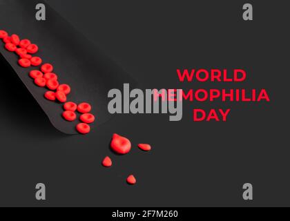 Concept de la Journée mondiale de l'hémophilie. Les globules rouges et les gouttes de sang sont faites d'argile plasticité sur fond noir. Banque D'Images