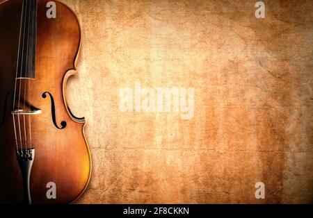 Violoncelle reposant sur un arrière-plan de grunge vierge avec espace de copie Banque D'Images