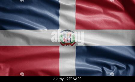 Drapeau Dominicana agitant dans le vent. Gros plan de la bannière de la République dominicaine soufflant, doux et lisse soie. Tissu texture ensign arrière-plan. Banque D'Images