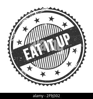 EAT IT UP texte écrit sur noir grungy zigzag bordures timbre rond. Banque D'Images