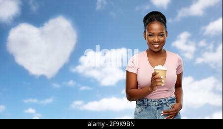 Happy african american woman drinking coffee Banque D'Images