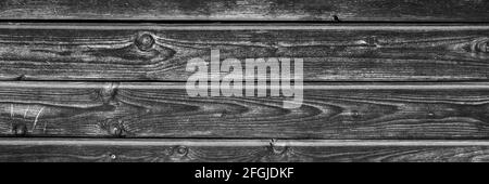 arrière-plan en bois. planches en bois noir brûlé vieilli. couleur noir et blanc teinté. bannière Banque D'Images