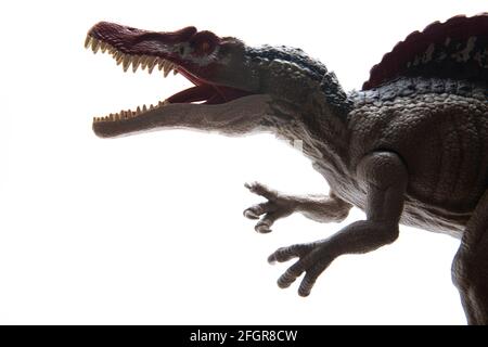 Enfant jouet éducatif en plastique dinosaure d'un Spinosaurus par Mattel sur fond blanc Banque D'Images