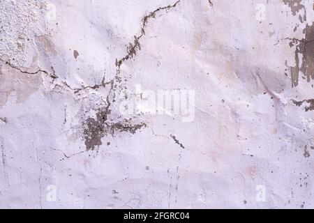 Sécheresse fissuré vieux mur de plâtre gris et blanc texture background Banque D'Images