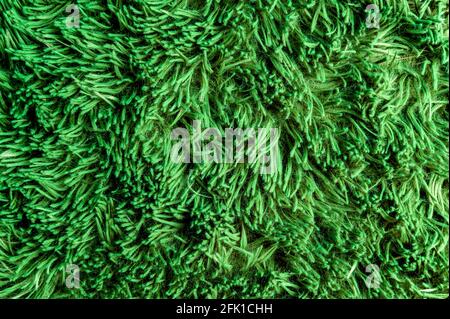 Texture de l'herbe verte artificielle. Vue de dessus de l'arrière-plan en gros plan. Arrière-plan Gress Banque D'Images