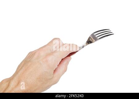 Humains main gauche tenant une fourchette d'argent isolée sur blanc. Concept. Banque D'Images
