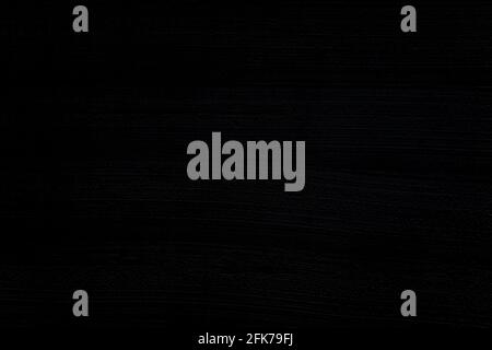 Gros plan sur un mur en plâtré gris foncé et presque noir inégal. Arrière-plan texturé plein format haute résolution sombre. Banque D'Images