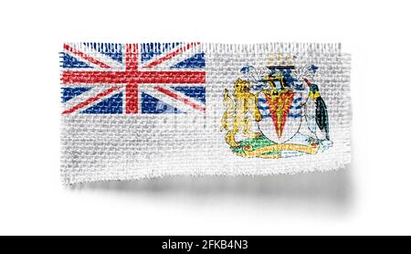 Drapeau du territoire de l'Antarctique britannique sur un morceau de tissu un arrière-plan blanc Banque D'Images