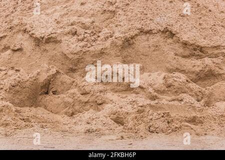 Pile de sable texture arrière-plan au chantier, gros plan. Banque D'Images