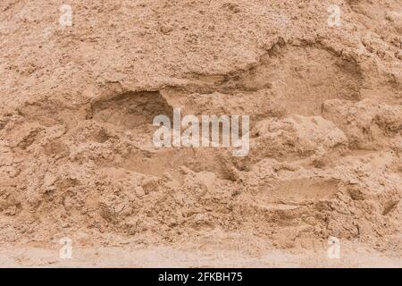 Pile de sable texture arrière-plan au chantier, gros plan. Banque D'Images