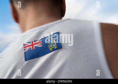 Le drapeau national de la Géorgie du Sud et du Sandwich du Sud Îles sur le dos de l'athlète Banque D'Images