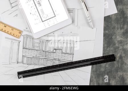 Le concepteur crée un plan de cuisine selon le dessin de un projet architectural Banque D'Images