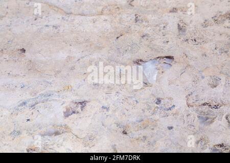 Texture de pierre naturelle de dolomite. Pierre avec motif beige sur une surface lisse. Finition du matériau de construction. Banque D'Images