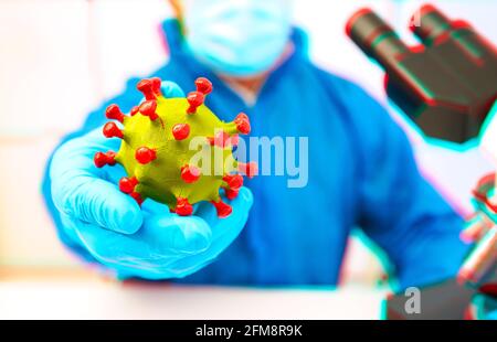 Médecin avec le modèle du coronavirus en main. Effet anaglyphe Banque D'Images
