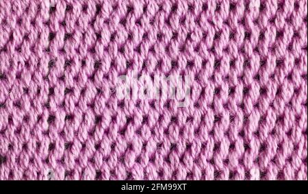 Gros plan sur des fibres de tissu rose, mise au point sélective. Banque D'Images